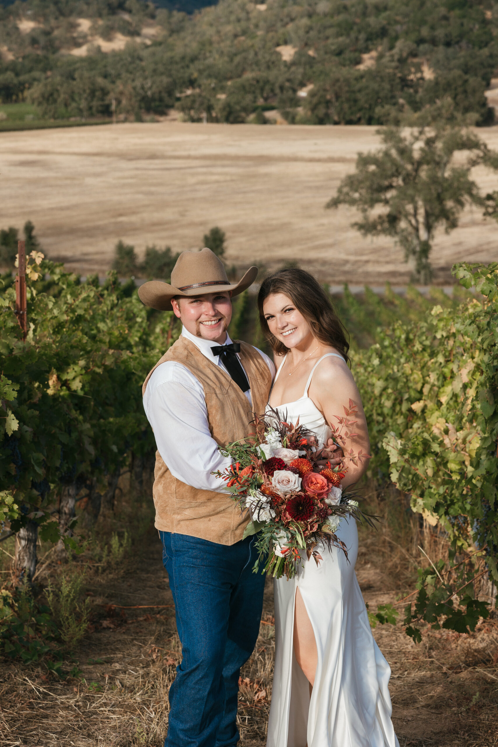 Bride and groom traditional pose at golden hour