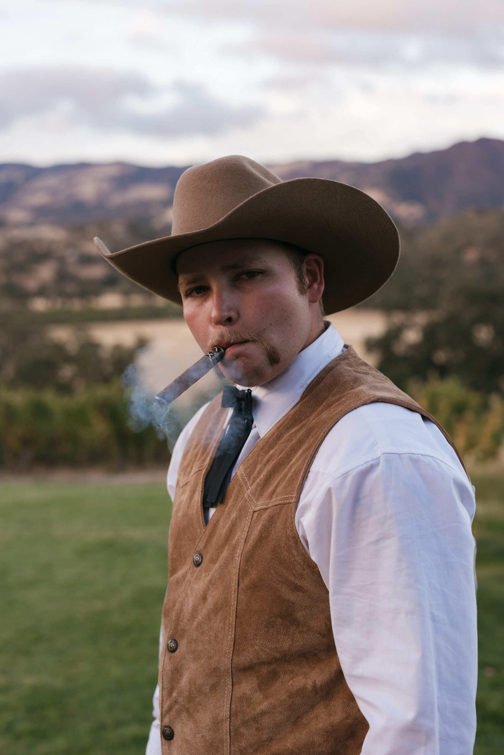 Cowboy groom and his cigar