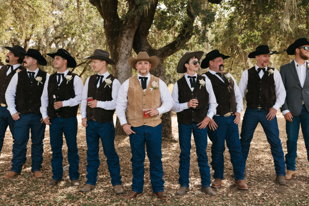 The flying V groomsmen shot of all the cowboys before the ceremony